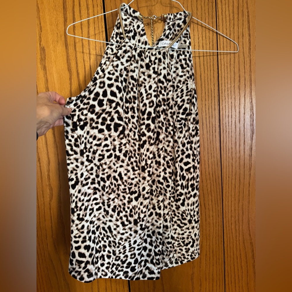 Calvin Klein Animal Print top. Gold halter style. Inside bra. Size M 20” PTP